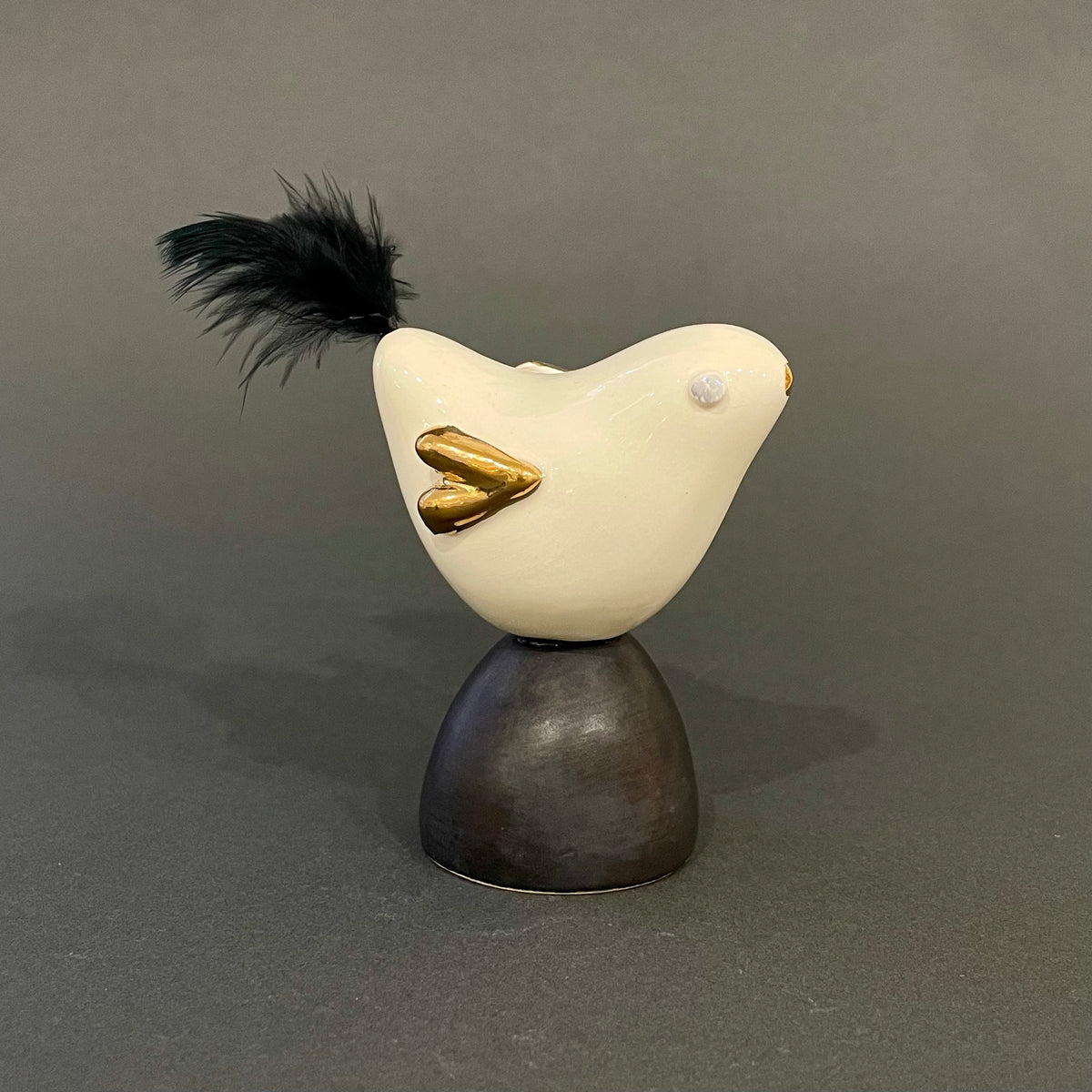 Bird on black pedestal Buckinghamshire Craft Guild
