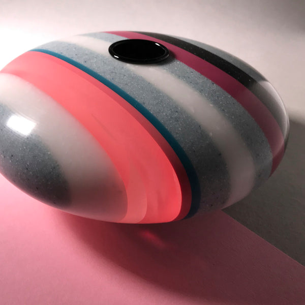 Disk shaped candle holder by Graham Lester
