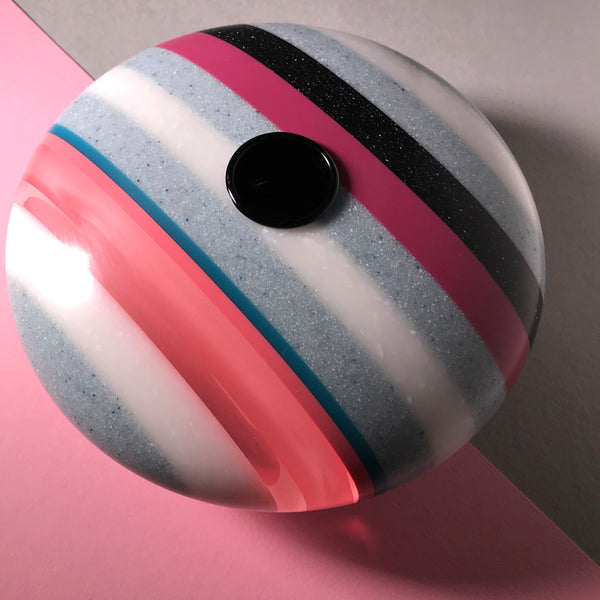 Disk shaped candle holder by Graham Lester 