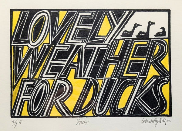 Artistic print with 'Lovely Weather for Ducks' text and ducks illustration.