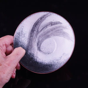 Red black, red and white enamelled copper dish
