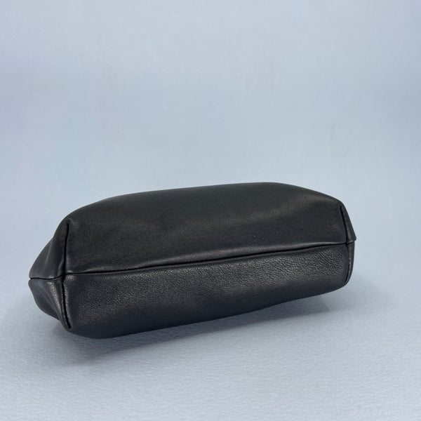 The base of the black leather purse