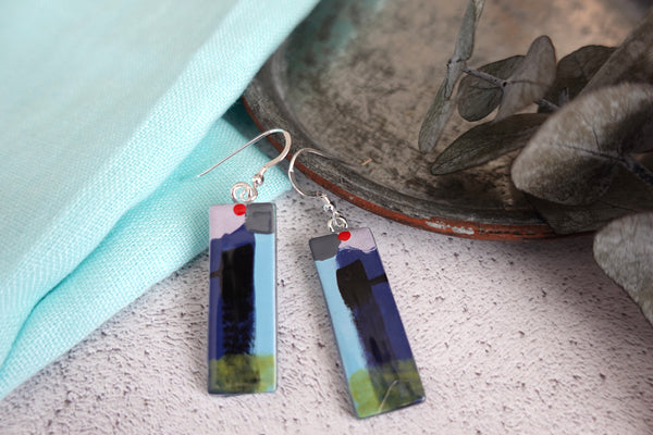 easy to wear light weight fused glass earrings in an abstract pattern using red, lilac and navy colours. Sterling silver ear wires 