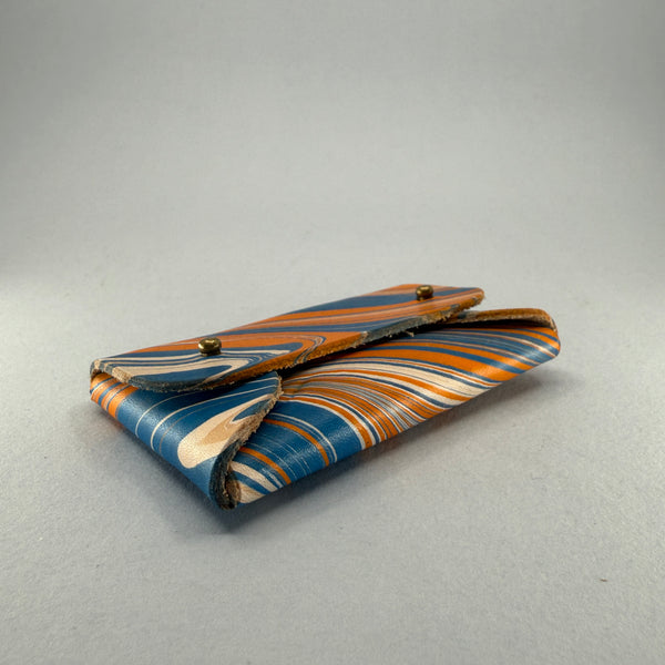 Angled right side and base view of the purse