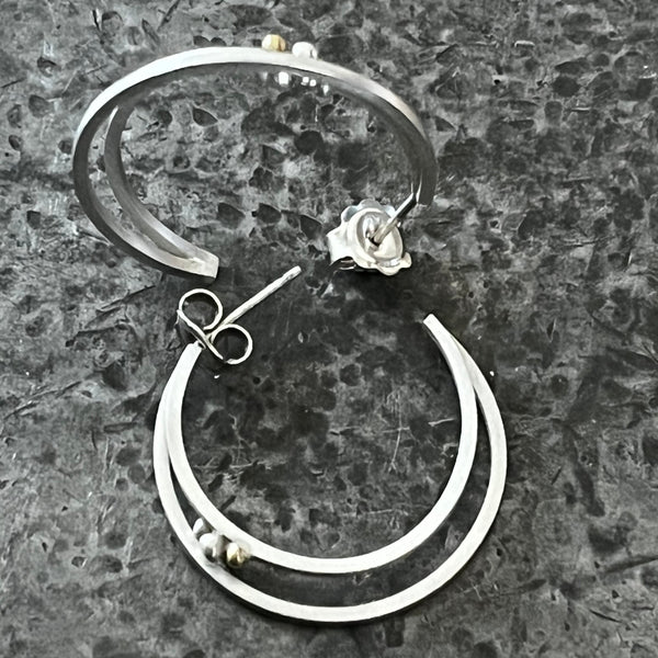 Double hoop earrings with small boulder ball detailing.