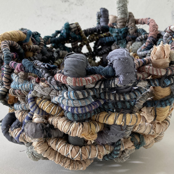 Hand woven textile basket
