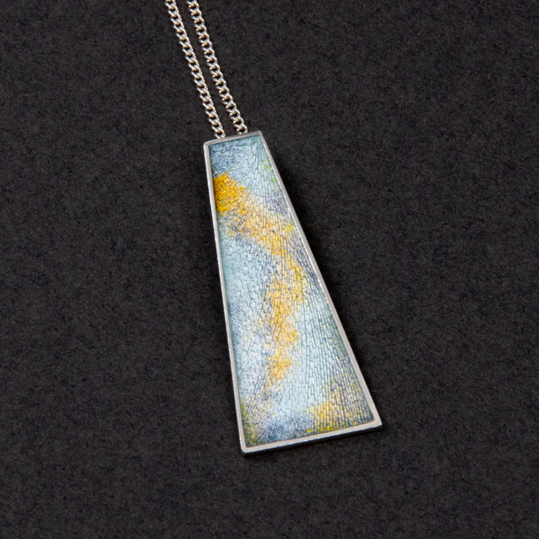 engraved pendant with orange and blue enamel by Heather Larson