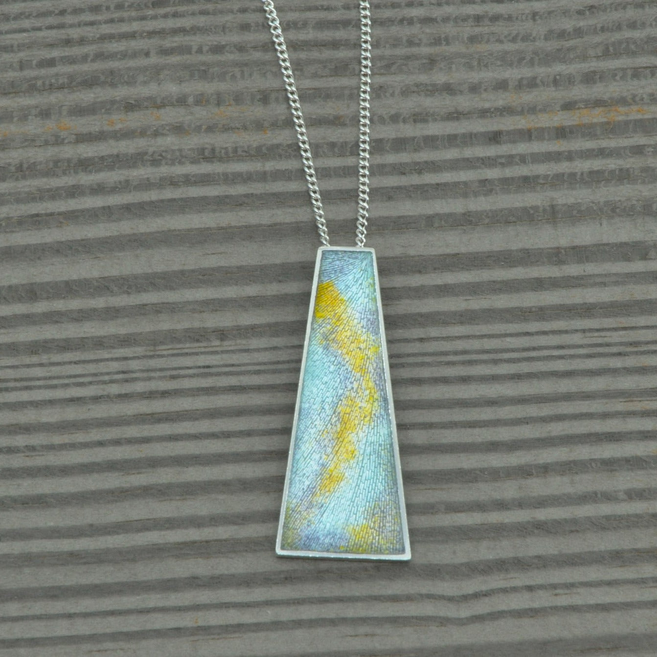 engraved pendant with enamel in soft colours by Heather Larson