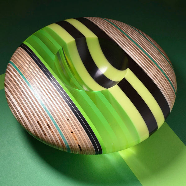 Green black and clear disk shaped bowls by Graham Lester 