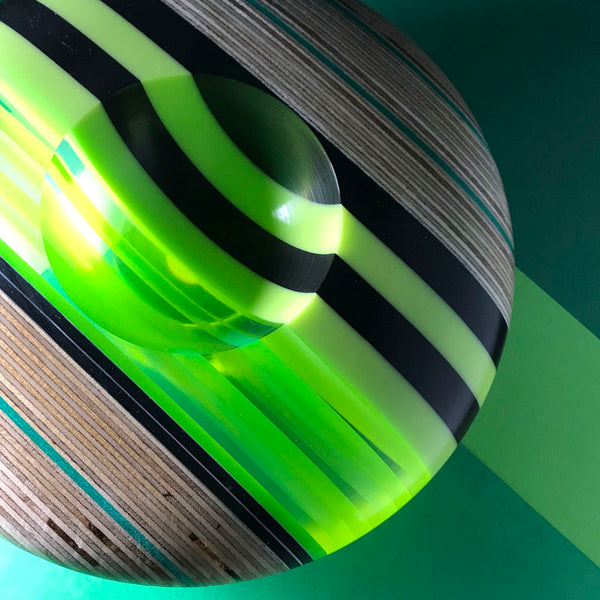 Green black and clear disk shaped bowls by Graham Lester 