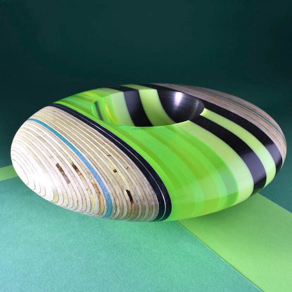 Green black and clear disk shaped bowls by Graham Lester 