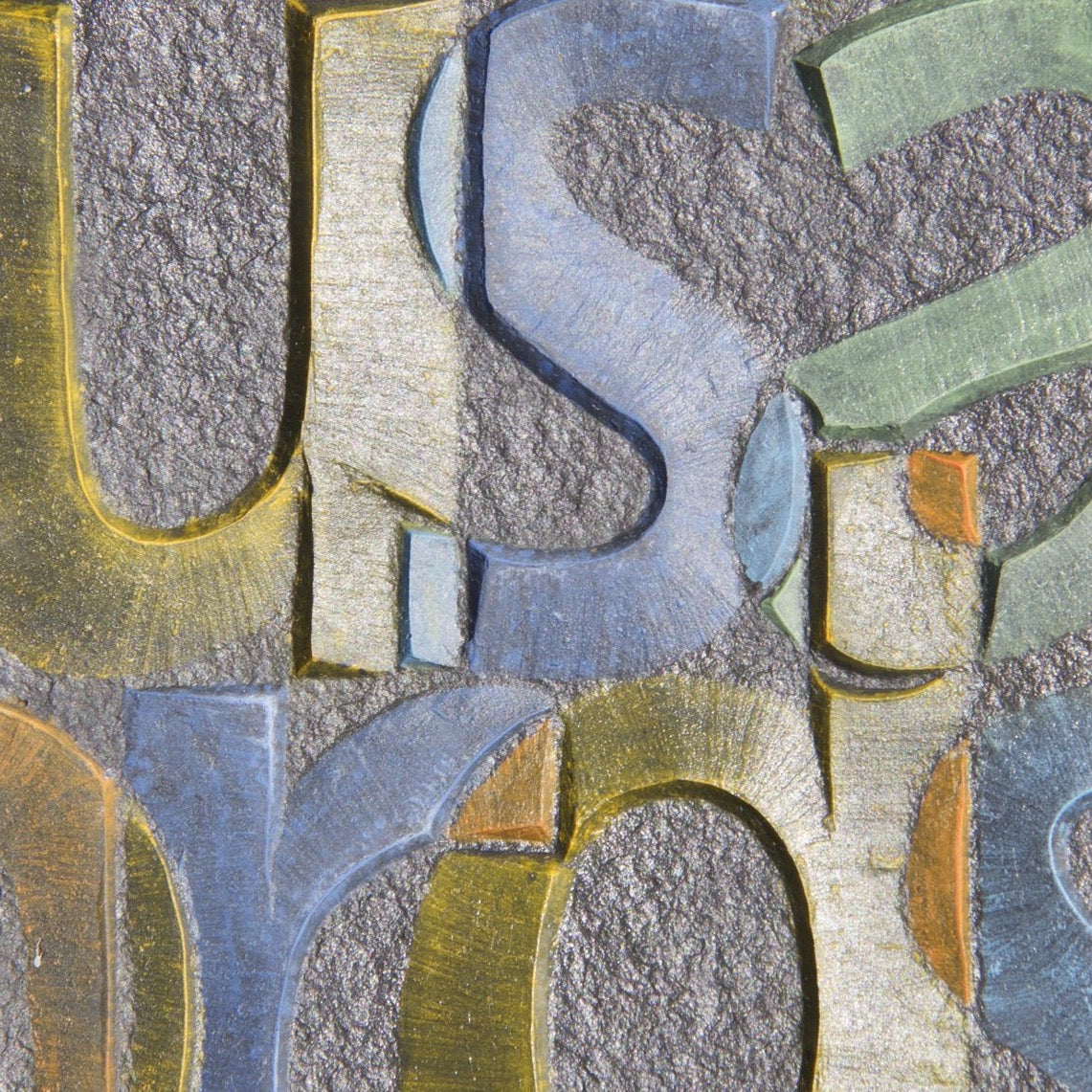 A picture paints  -  Burlington Grey flame textured slate carved and painted by Annet Stirling